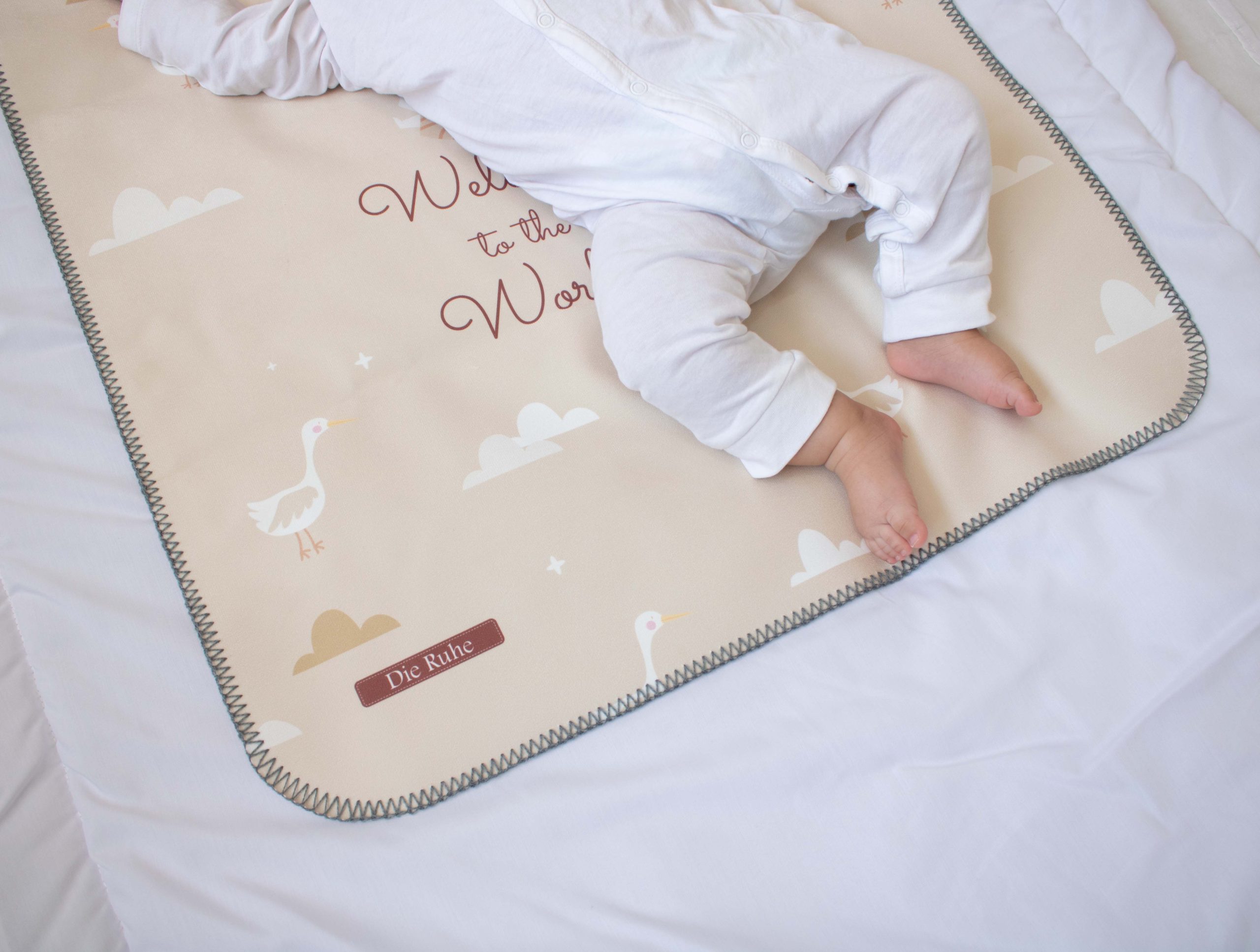 زیرانداز تعویض نوزاد طرح لک لک دی‌روحه ضدآب و قابل شستشو